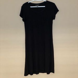 Black t-shirt dress with a pocket on the front. Cotten and spandex material.